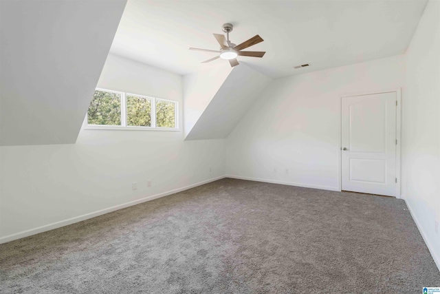 additional living space featuring ceiling fan, vaulted ceiling, and carpet