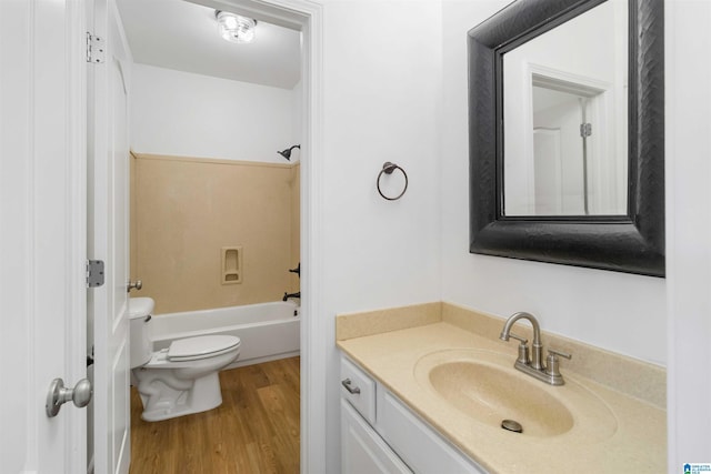 full bathroom with vanity, wood-type flooring, shower / bathtub combination, and toilet