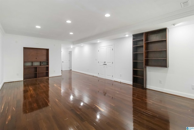 unfurnished living room featuring dark hardwood / wood-style floors