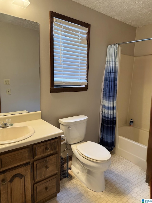 full bathroom with vanity, shower / bath combination with curtain, a textured ceiling, and toilet