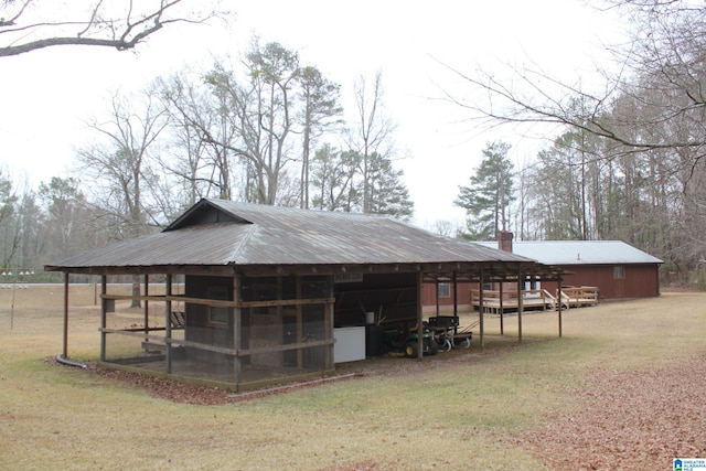 view of outbuilding with a yard