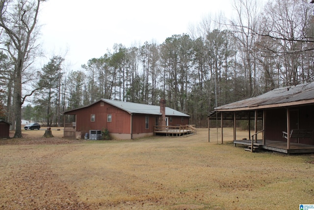 view of yard featuring a wooden deck