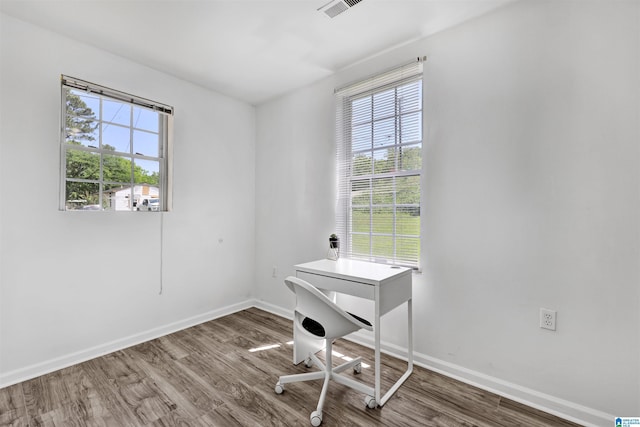 212 E 28th St, Anniston, AL 36201 - home office featuring plenty of natural light, wood finished floors, and baseboards