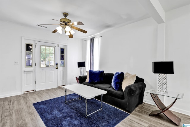 212 E 28th St, Anniston, AL 36201 - living room featuring ceiling fan, wood finished floors, and baseboards