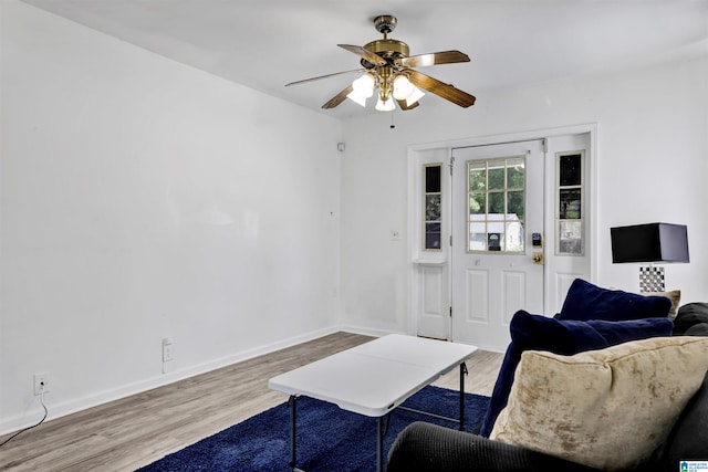 212 E 28th St, Anniston, AL 36201 - living room featuring wood finished floors, ceiling fan, and baseboards