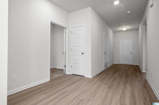 hallway featuring light hardwood / wood-style flooring