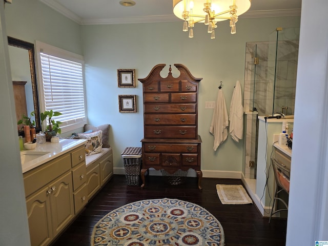 bathroom with an enclosed shower, hardwood / wood-style floors, a notable chandelier, and crown molding