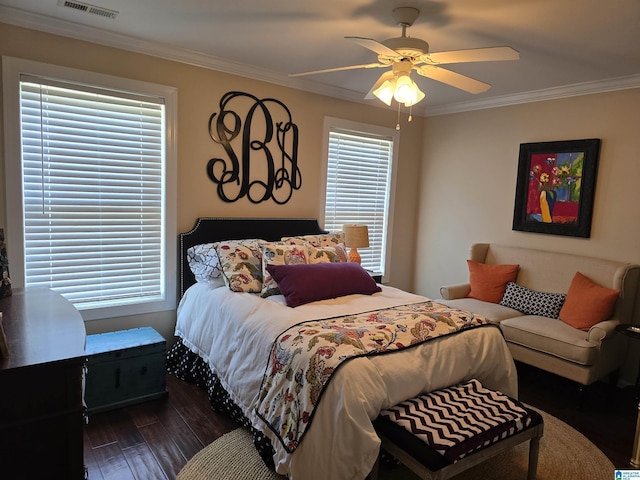 bedroom with multiple windows, ornamental molding, and ceiling fan