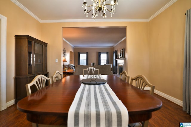 dining area with crown molding, dark hardwood / wood-style floors, and an inviting chandelier