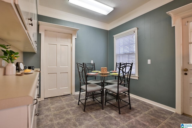 dining room featuring ornamental molding