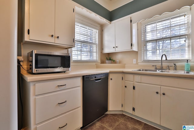 kitchen with white cabinetry, sink, a wealth of natural light, and dishwasher