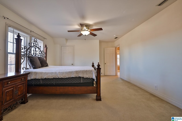 bedroom featuring light carpet and ceiling fan