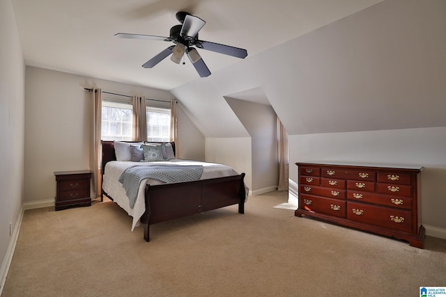 carpeted bedroom featuring ceiling fan and vaulted ceiling