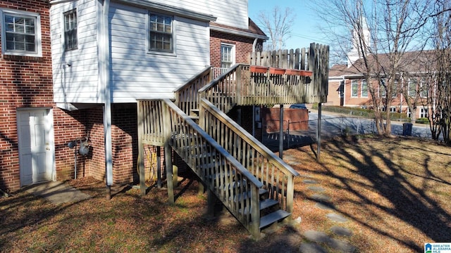 rear view of property featuring a deck