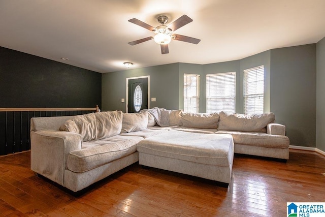 living room with ceiling fan and hardwood / wood-style floors