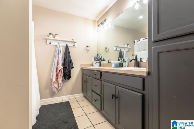 bathroom with vanity and tile patterned floors