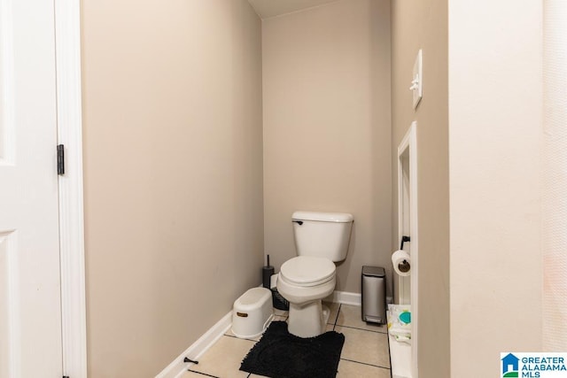 bathroom featuring tile patterned flooring and toilet