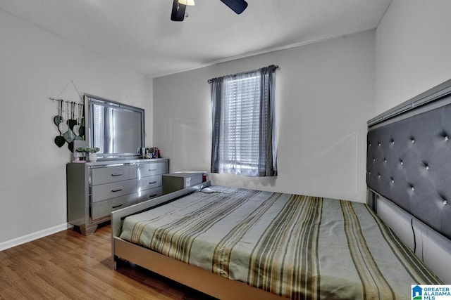 bedroom featuring ceiling fan and light wood-type flooring