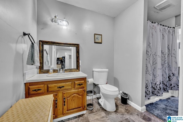 bathroom with vanity, a shower with curtain, and toilet