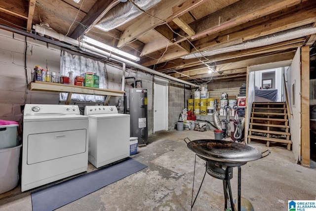 basement with washing machine and clothes dryer and electric water heater