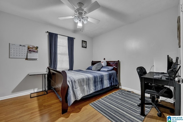 bedroom featuring ceiling fan and wood-type flooring