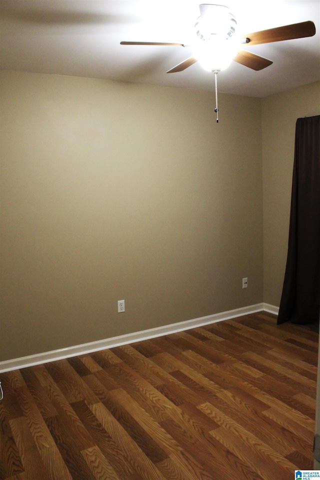 unfurnished room featuring ceiling fan and dark hardwood / wood-style flooring