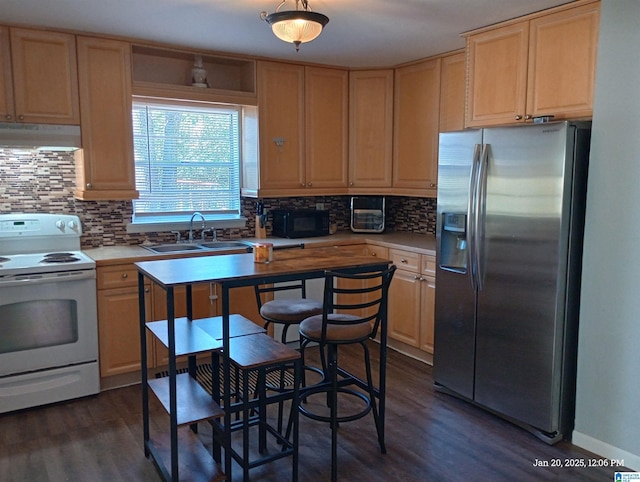 kitchen featuring dark wood-type flooring, white electric range oven, sink, tasteful backsplash, and stainless steel fridge with ice dispenser