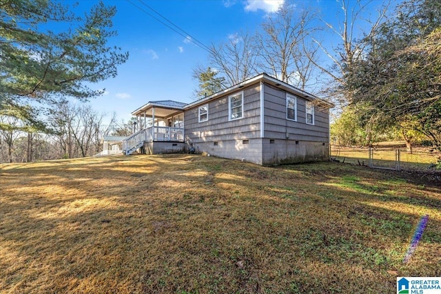 view of property exterior with a yard