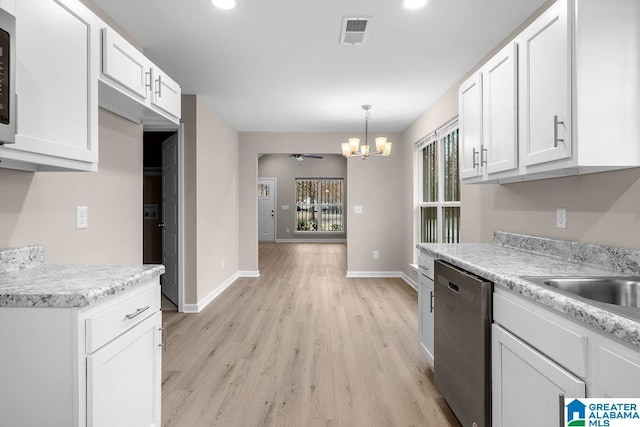 kitchen featuring white cabinetry, decorative light fixtures, stainless steel dishwasher, and light hardwood / wood-style floors