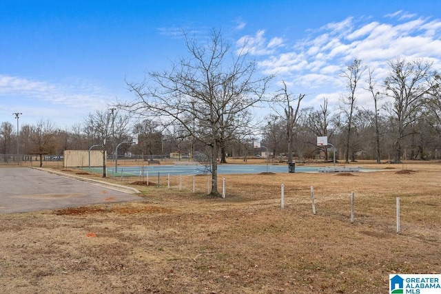 view of yard with basketball court