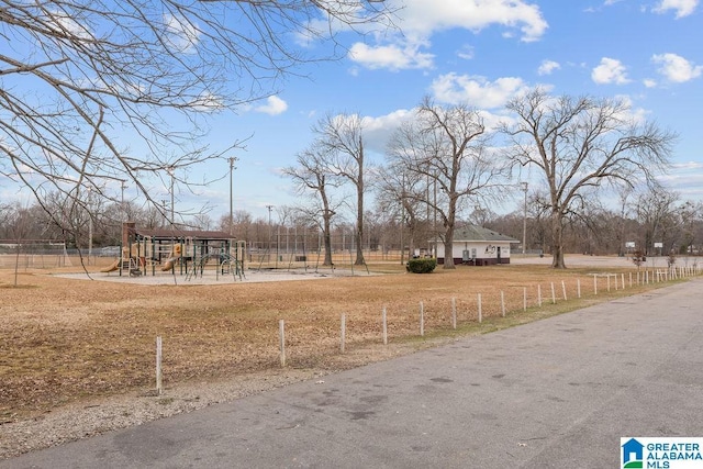 view of yard with a playground and a rural view