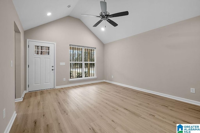 interior space featuring ceiling fan, lofted ceiling, and light wood-type flooring