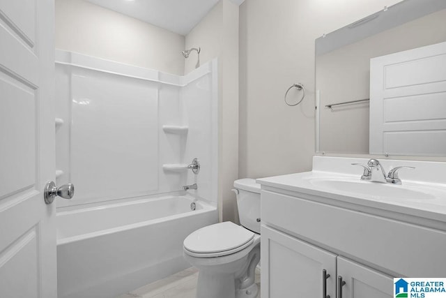 full bathroom featuring vanity, washtub / shower combination, and toilet