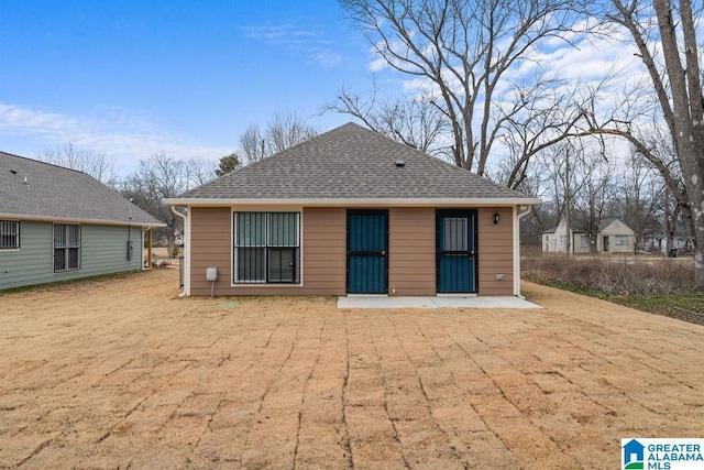 back of house with a patio