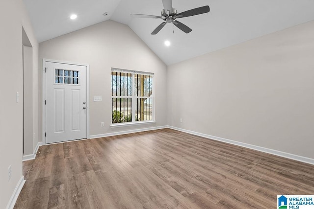 entryway featuring hardwood / wood-style flooring, ceiling fan, and high vaulted ceiling