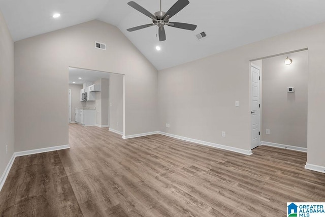 unfurnished living room featuring ceiling fan, high vaulted ceiling, and light hardwood / wood-style floors