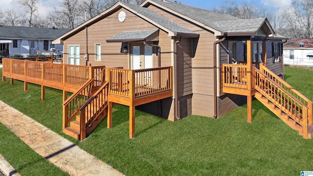 view of playground with a yard and a deck