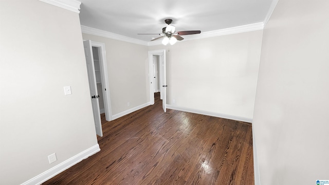 unfurnished room with crown molding, dark hardwood / wood-style floors, and ceiling fan