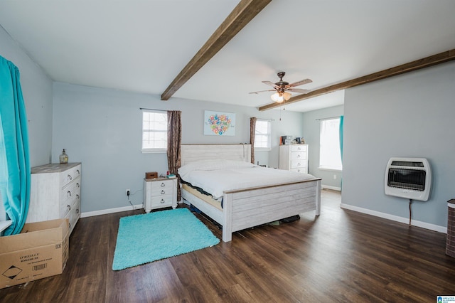 bedroom with dark wood-type flooring, ceiling fan, beam ceiling, and heating unit