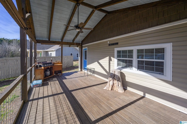 wooden deck featuring a grill and ceiling fan