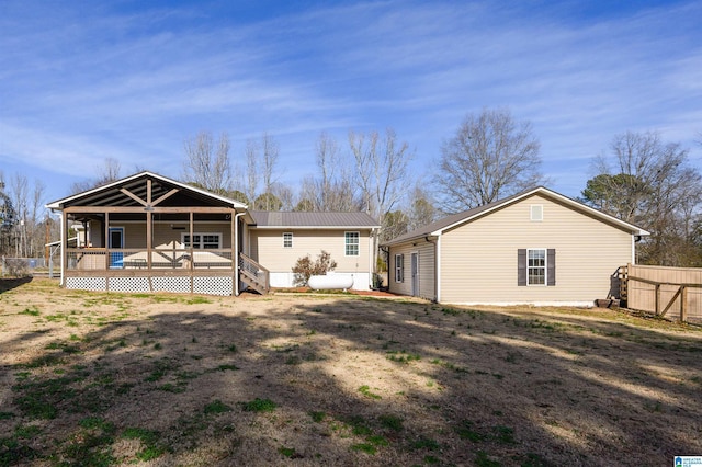 back of property featuring a deck