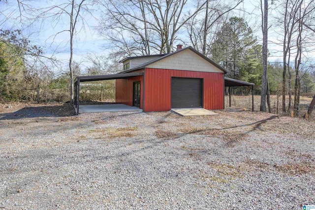 garage featuring a carport