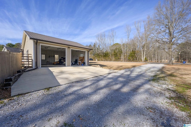 exterior space featuring a garage and an outdoor structure