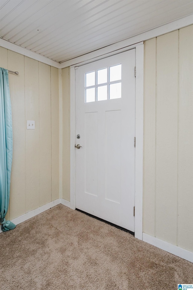 entrance foyer featuring light colored carpet