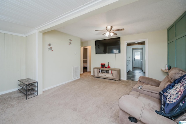 carpeted living room featuring ceiling fan