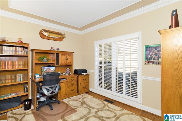 office featuring ornamental molding and light hardwood / wood-style floors