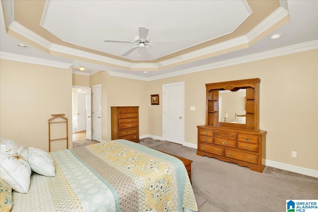 carpeted bedroom featuring crown molding, ceiling fan, and a tray ceiling