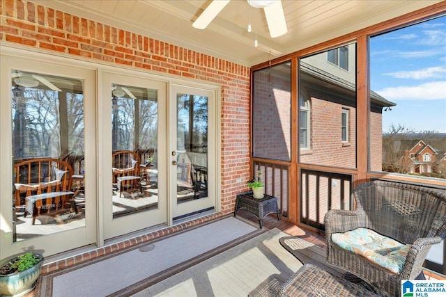 sunroom / solarium featuring ceiling fan