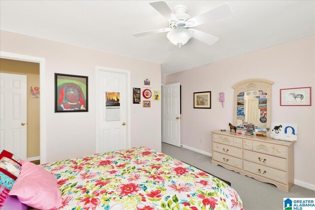 carpeted bedroom with ceiling fan