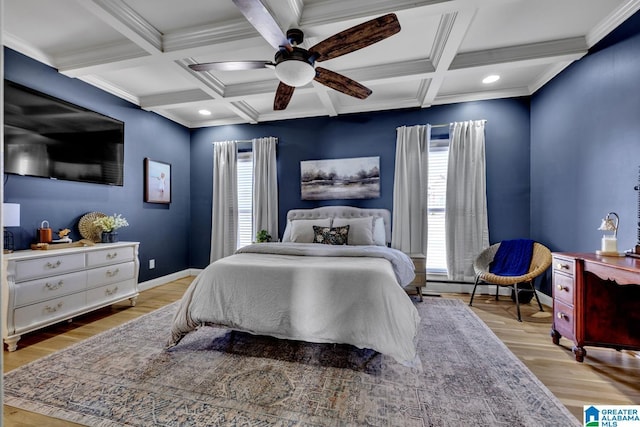 bedroom featuring coffered ceiling, beam ceiling, light hardwood / wood-style floors, and ceiling fan